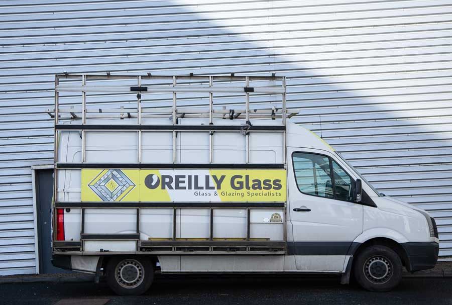 O'Reilly Glass van with the logo fixed to the side
